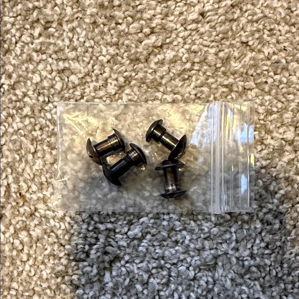 Black combat helmet bolts